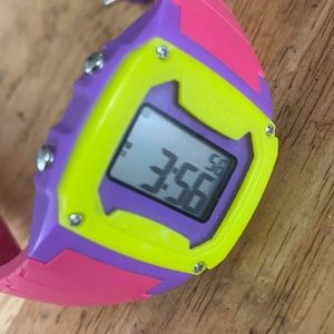 Women's men's shark freestyle watch. Pink, purple, yellow silicone band.